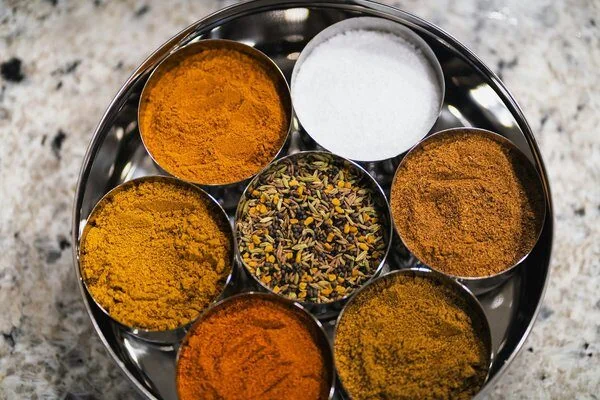 Indian spices including cardamom, cloves and cinnamon — natural incense ingredients