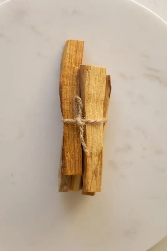 Palo Santo sacred wood sticks in wooden bowl