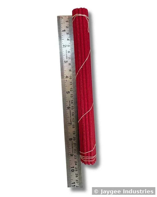 Tibetan incense sticks approximately 27cm in length shown alongside a ruler